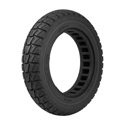 Black tire with tread pattern on a white background