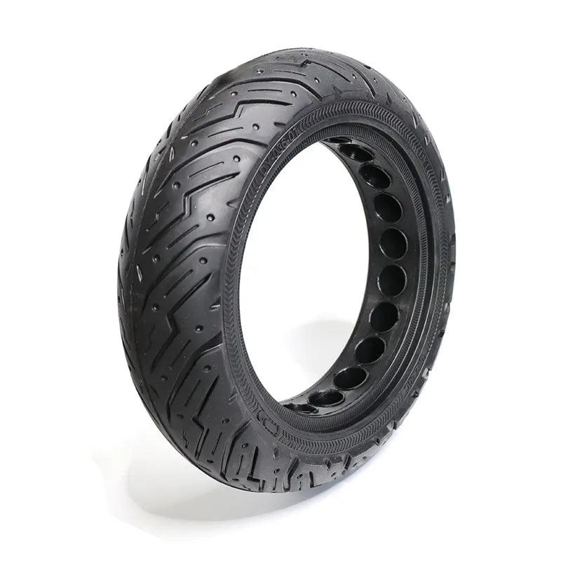Black tire with unique tread pattern on a white background
