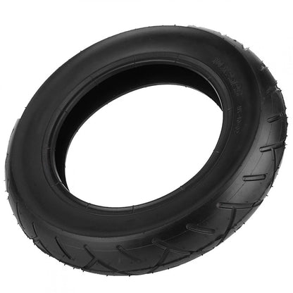 Black tire with tread pattern on a white background
