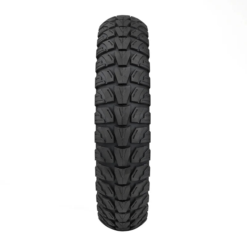 Black off-road tire with tread pattern on a white background