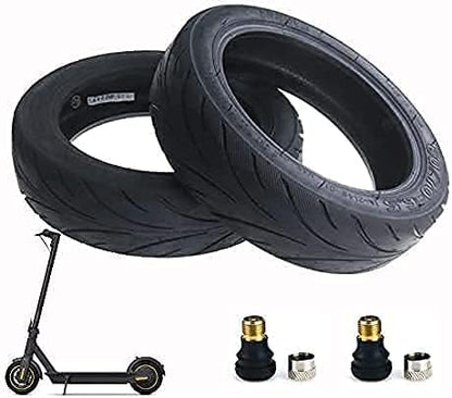 Two scooter tires with a scooter and accessories on a white background
