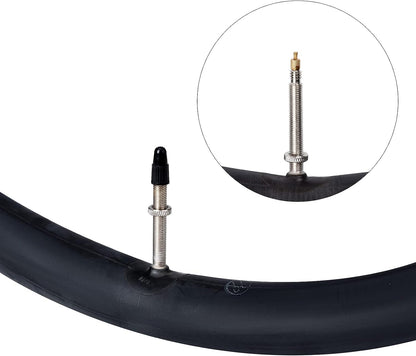 Bicycle tire with valve core and cap on a white background