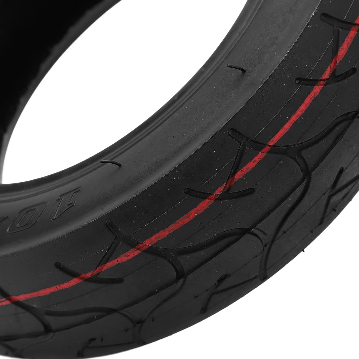 Close-up of a black tire with red accents on a white background
