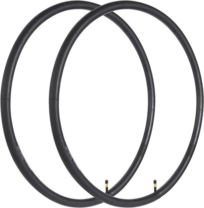Two black bicycle wheels on a white background