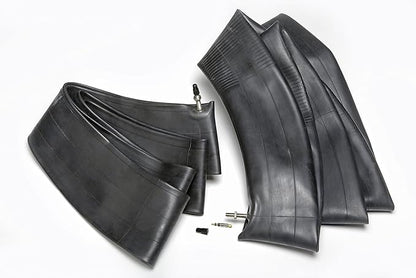 Two motorcycle tires and inner tubes on a white background