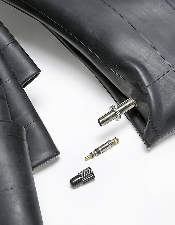 Tire pressure gauge and valve stems on a white background