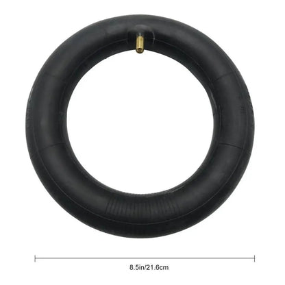 Black inner tube with valve on a white background