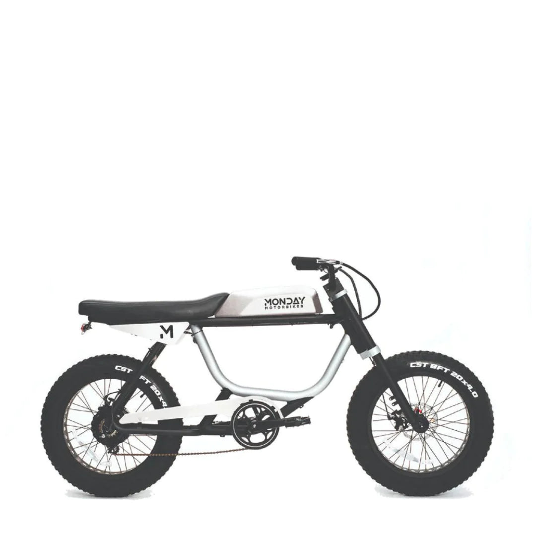 Children's bike with white frame and black tires on a white background