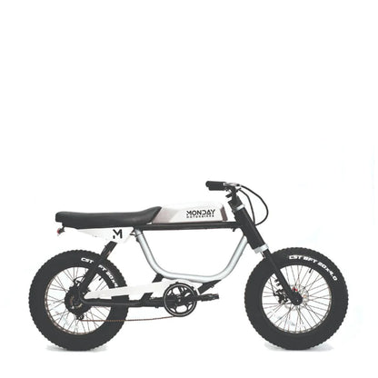 Children's bike with white frame and black tires on a white background