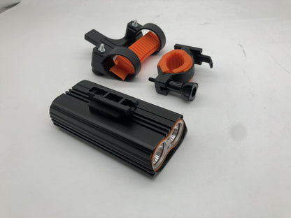 Black and orange electronic components on a white background