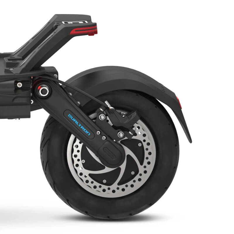 Close-up of a scooter wheel with visible branding on a white background