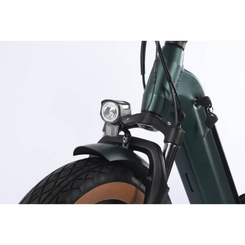 Close-up of a green electric bike with a headlight on a white background