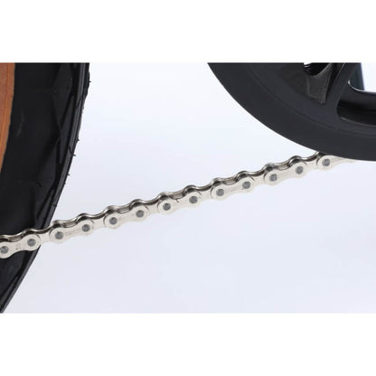 Close-up of a motorcycle chain on a white background