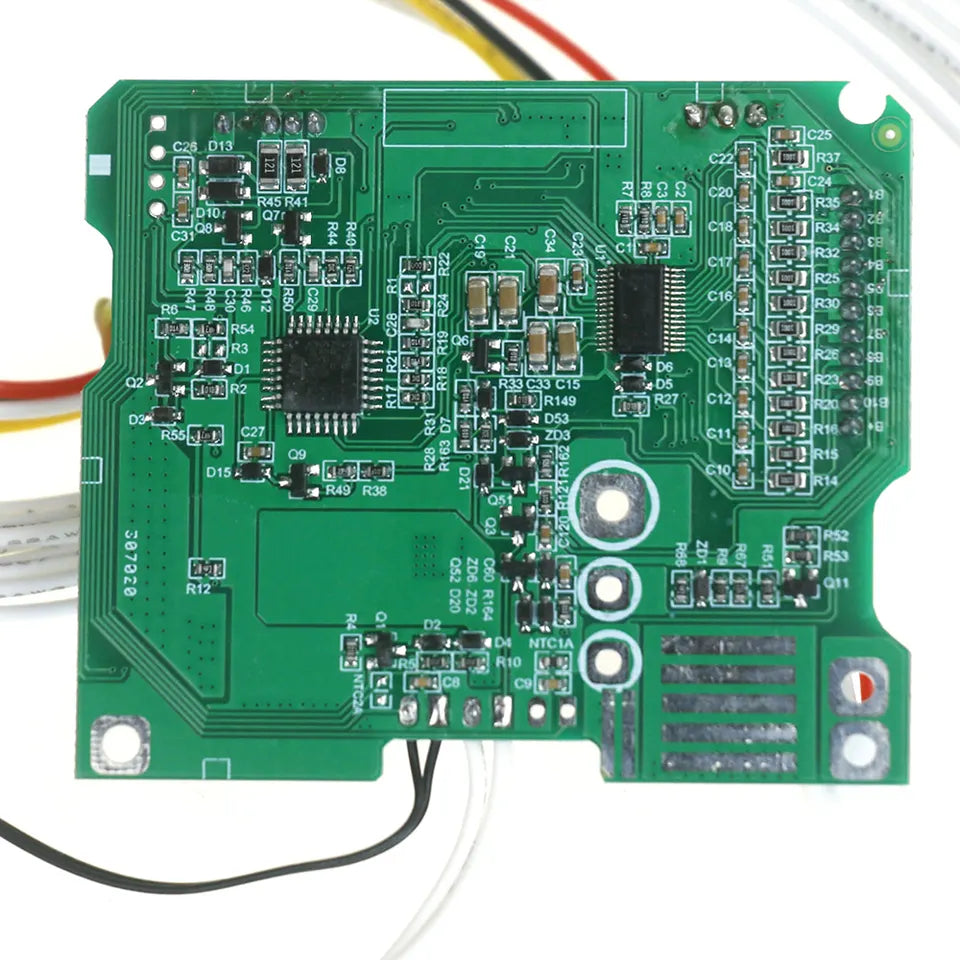 Green electronic circuit board with various components on a white background