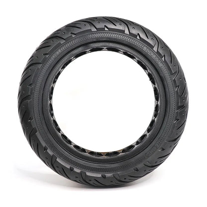 Black tire with tread pattern on a white background
