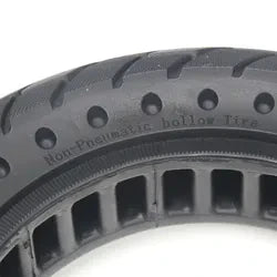 Close-up of a tire with tread pattern on a white background
