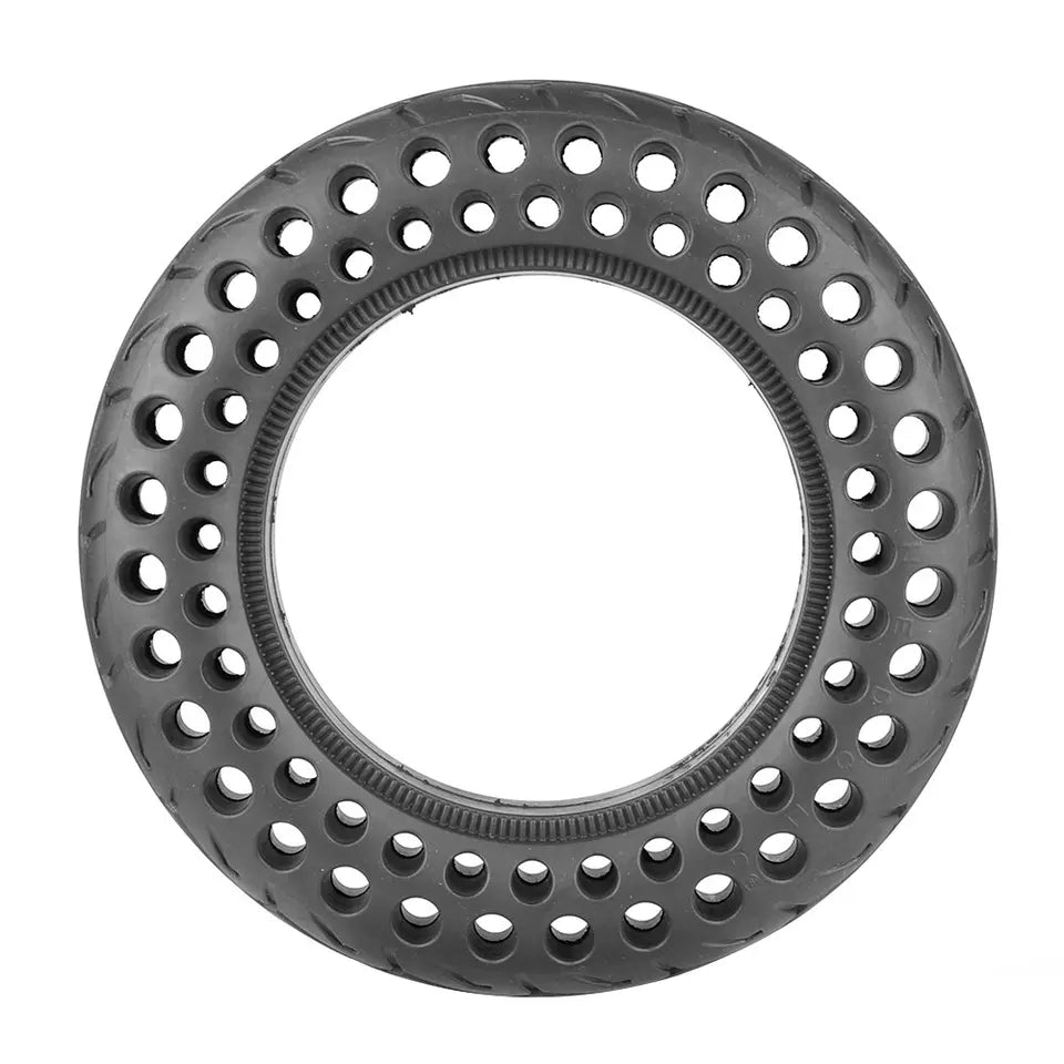 Black metal ring with circular holes on a white background