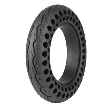 Black off-road tire with unique tread pattern on a white background
