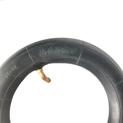 Black tire with valve stem on a white background