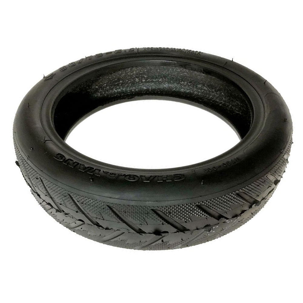 Black tire with tread pattern on a white background