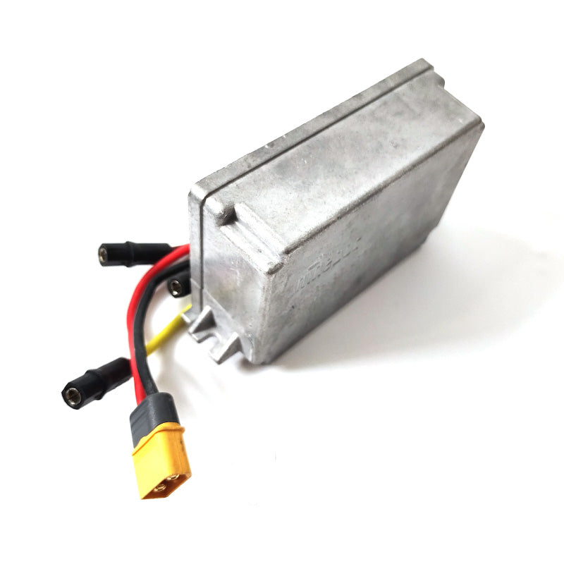 Rectangular metal battery pack with colorful cables on a white background