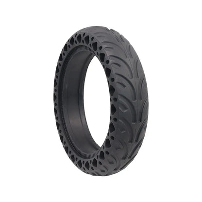 Black tire with unique tread pattern on a white background