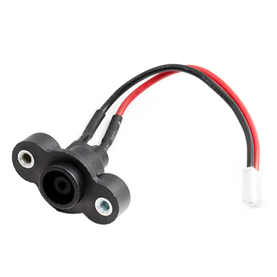 Black electronic component with red and black wires on a white background