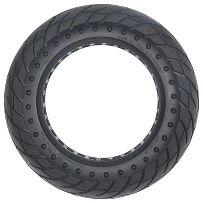 Black tire with tread pattern on a white background