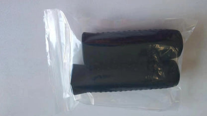 Two black cylindrical objects in a clear plastic bag on a white background