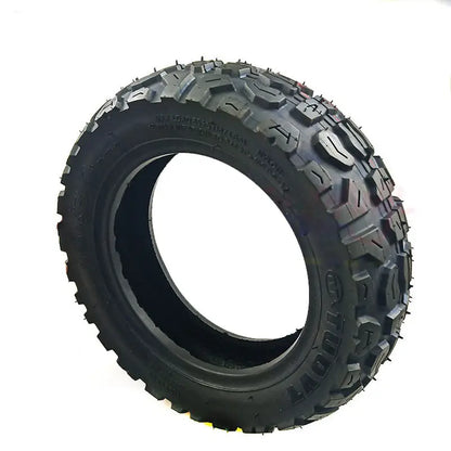 Off-road tire with prominent tread pattern on a white background