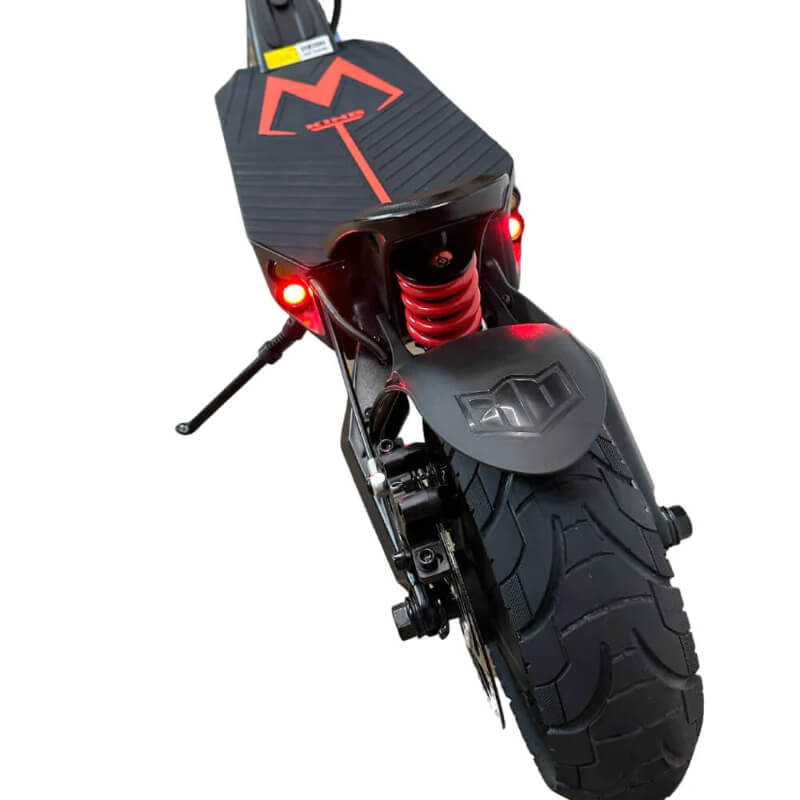 Close-up of a scooter's front wheel and suspension on a white background