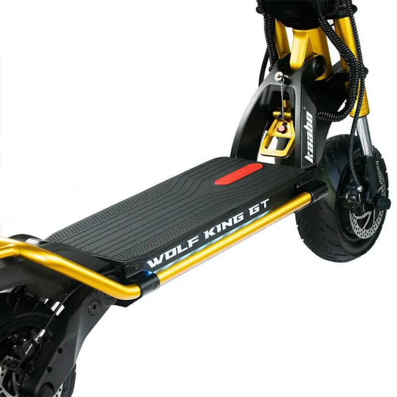 Close-up view of the Kaabo Wolf King GT Pro's wide deck, featuring the "Wolf King GT" branding, highlighting its stability and comfort for long rides.