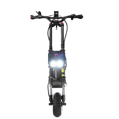 Front view of the Kaabo Wolf King GTR scooter with bright headlights turned on, emphasizing its visibility and safety features for night rides
