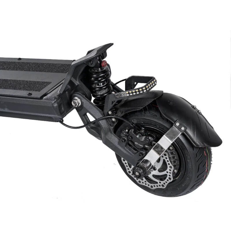 Close-up of a scooter's wheel and suspension system on a white background