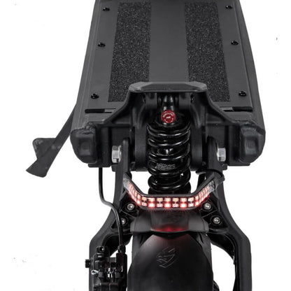Close-up of a scooter's suspension system with visible branding on a white background