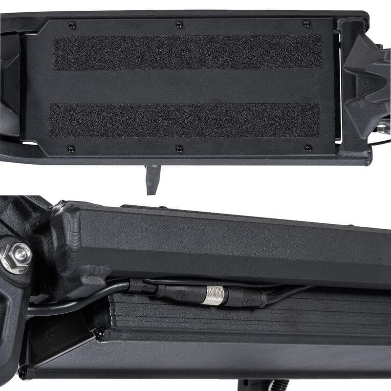 Close-up of a black motorcycle storage tray with mounting hardware on a white background