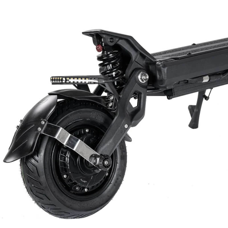 Close-up of a scooter's wheel and suspension system on a white background