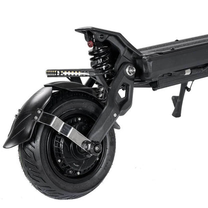Close-up of a scooter's wheel and suspension system on a white background