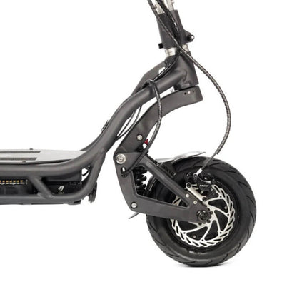 Close-up of a black electric scooter's rear wheel and suspension on a white background