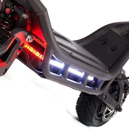 Close-up of a scooter with visible lights on a white background