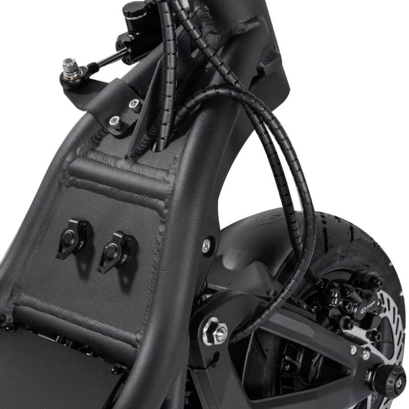 Close-up of a black electric bike frame with visible wiring and components.