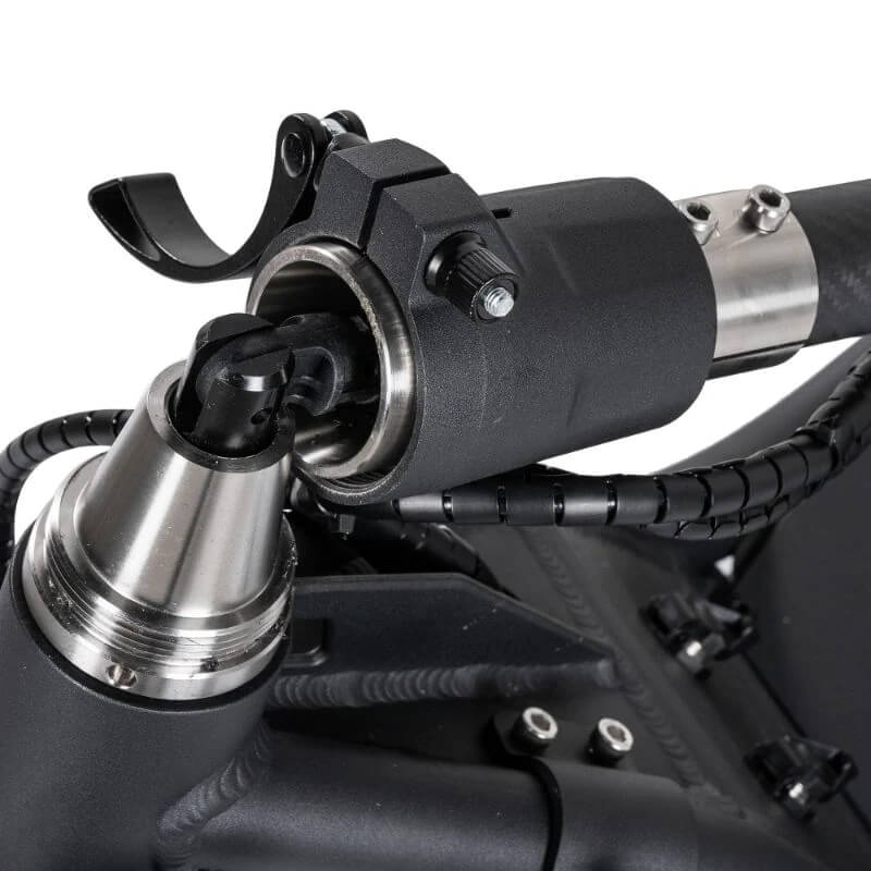Close-up of a mechanical component with black and silver finish on a white background
