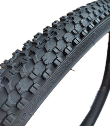 Close-up of a bicycle tire with tread pattern on a white background