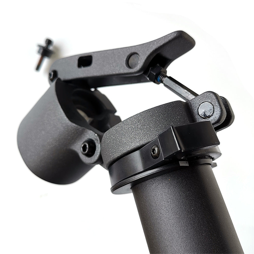 Close-up of a black adjustable tripod head on a white background