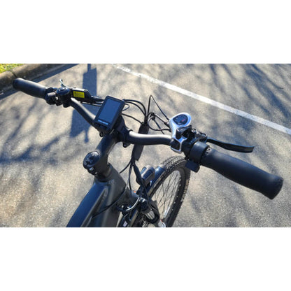 Bicycle handlebar with control buttons on a road