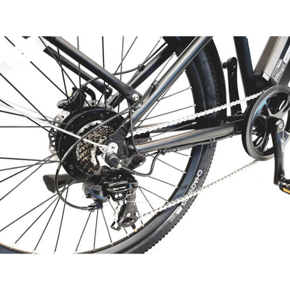 Close-up of a bicycle's rear wheel and gear system on a white background