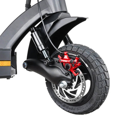 Close-up of a motorcycle wheel with a red brake caliper on a white background