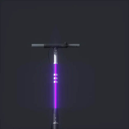 E-scooter with a glowing purple light on a black background