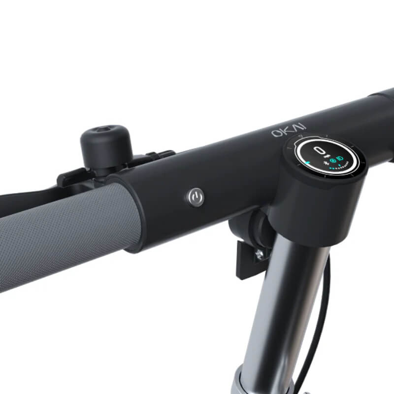 Close-up of a bicycle handlebar with control buttons on a white background