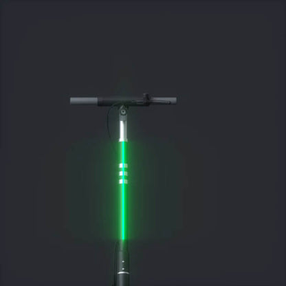 Green scooter with glowing lights on a black background
